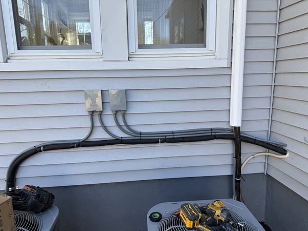HVAC disconnect whips installed on exterior wall