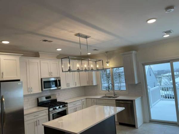 Finished kitchen with recessed and pendant lighting
