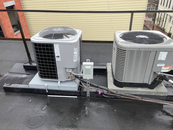 Rooftop AC condenser units with electrical disconnects