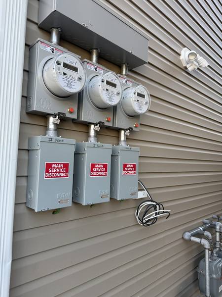 Three-unit meter bank with main service disconnects